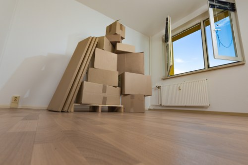 Removal truck loaded with household boxes and furniture